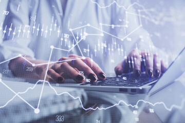 Double exposure of woman hands typing on computer and forex chart hologram drawing. Stock market...