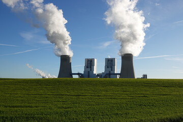 Fototapeta na wymiar Coal-fired power station in Neurath, which generates steam from cooling towers