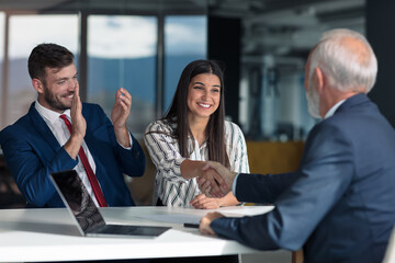 Young couple meeting financial advisor for home investment