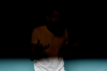 Bearded man emotions facial expression gestures hands close-up blue background