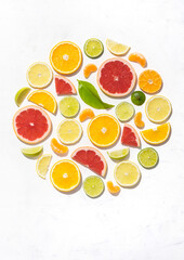 Colorful pattern made of slices of citrus fruits orange, lemon, lime and grapefruit. Gin garnish concept