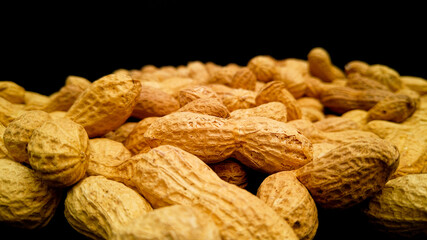 Roasted peanuts in close up - food photography