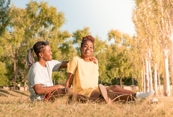 A happy couple on in a park in summertime