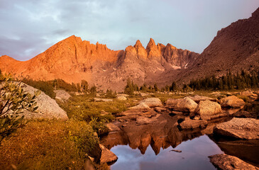 Fototapeta na wymiar Evening light on the breathtaking Cirque of Towers, seen from Shadow Lake, Wind River Range, Wyoming, USA