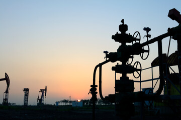 In the field, the oil pipeline in the evening