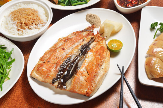 Fried milkfish belly on white plate