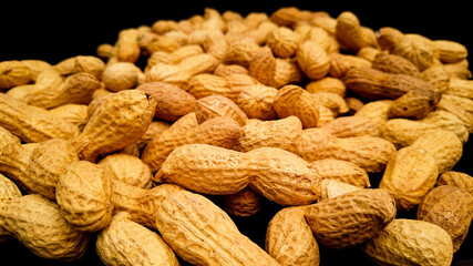 Roasted peanuts in close up - food photography