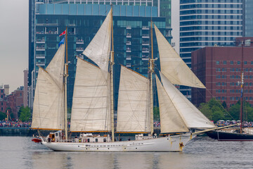 A ship at full sail in Boston Harbor