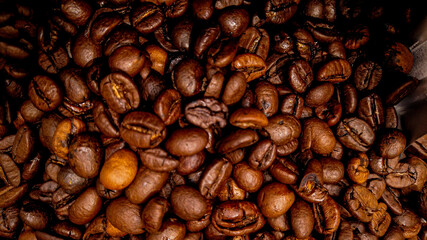 Coffee beans freshly roasted in close up - food photography