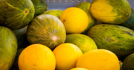 fresh melons at a farmers market