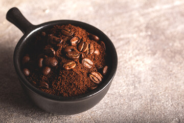 Ground coffee and coffee beans in