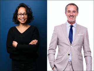 Two beautiful women in front of a background