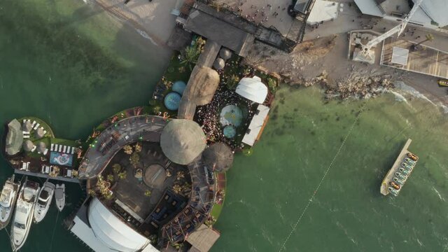 Scenic Top View of a Beach Festival location with people around pool in tropical Croatia, Aerial Overhead Birds Eye View