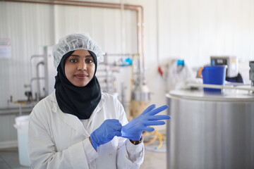 African black muslim business woman in local cheese production company