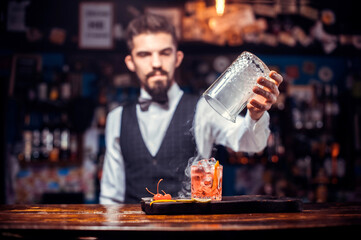 Barman mixes a cocktail at the beerhouse