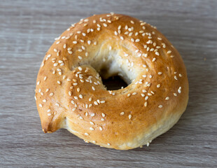 Freshly baked Brioche bun in doughnut shape with sesame seeds