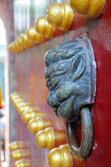 Lion head door knockers used to knock the door scene from Lotus Castle,GuangZhou,China. 
