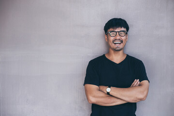 portrait young asian man wear eye glasses smiling cheerful look thinking position with perfect...