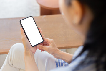 cell phone blank white screen mockup.woman hand holding texting using mobile on desk at office.background empty space for advertise.work people contact marketing business,technology