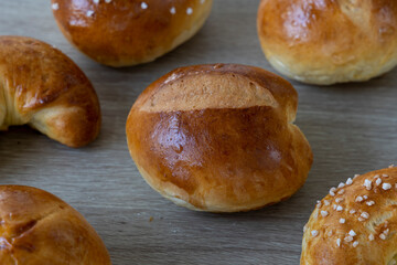 Freshly baked Brioche rolls on wooden board