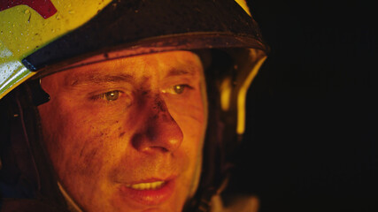 Portrait shot of a fireman in helmet. . High quality photo
