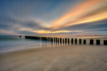 Baltic Sea, Chalupy town, Poland - fortifications on the beach shore against the sea waves