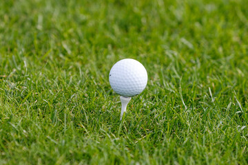 Golf ball in golfer's hand. 