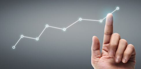 Hand touching a graphs of financial indicator accounting market economy analysis chart