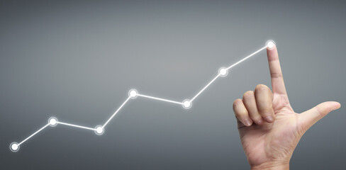 Hand touching a graphs of financial indicator accounting market economy analysis chart