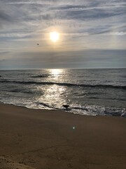 sun shining on the ocean reflection