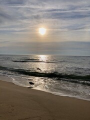 sun shining on the ocean reflection