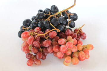 Ripe red grape. Dark grapes, Pink bunch with on white background.