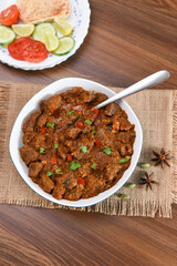 Kerala beef curry , Goan style beef vindaloo , Indian food Lamb or beef curry . spicy Beef curry gravy popular in Kerala Sri Lankan Goa side dish for Appam, Parotta porotta roti bread in India.