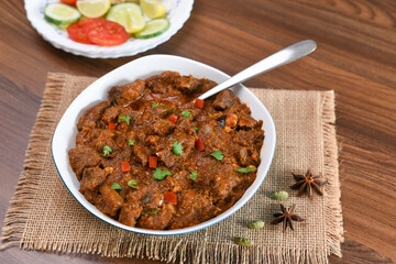 Spicy beef curry , Goan style beef vindaloo , Traditional Indian Lamb or beef curry . spicy Beef curry gravy popular in Kerala Sri Lankan Goa side dish for Appam, Parotta porotta roti bread in India.