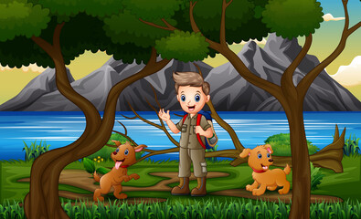 A scout boy and dogs in the forest landscape