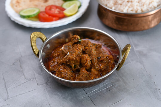 Kerala beef curry , Goan style beef vindaloo , Indian food Lamb or beef curry . spicy Beef curry gravy popular in Kerala Sri Lankan Goa side dish for Appam, Parotta porotta roti bread in India.