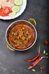 Spicy Madras beef curry , Goan style beef vindaloo , Traditional Indian Lamb curry . spicy Beef curry gravy popular Chennai, Kerala Sri Lankan Goa side dish Appam, Parotta porotta roti bread in India.