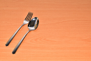 Cutlery Silverware Set with Spoons, forks  on wooden table with copy space. Selective Focus.