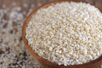 Close up,White sesame on wooden background,Sesame background,copy space.