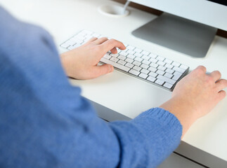 Fototapeta premium woman working on desktop pc at desk