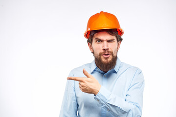 Man in shirt orange helmet safety emotions construction professional cropped view