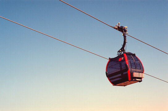 View of the cable car to the peaks of the Tatra Mountains in Tatranska Lomnica in Slovakia in summer. Real grain scanned film.