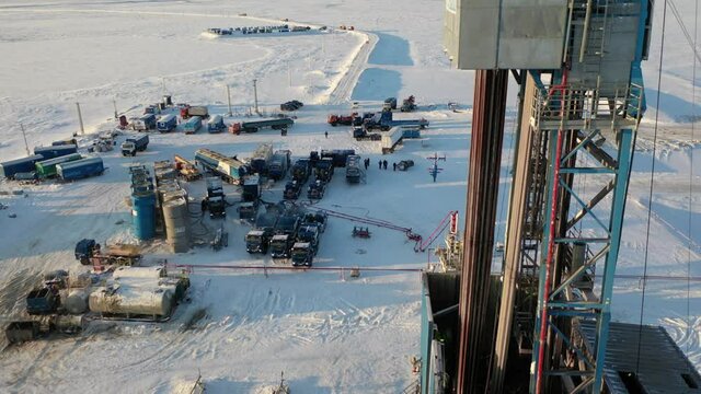 hydraulic fracturing fleet working at the gas drilling rig during the day