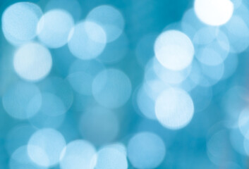 Defocused abstract blue-white christmas background. Christmas bokeh