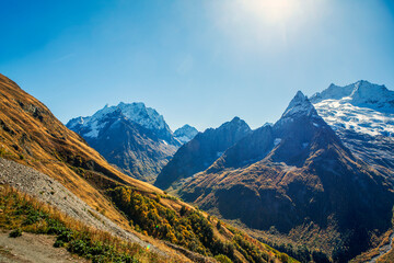 Fototapeta premium Picturesque peaks of the Dombay-Ulgen, Dzhuguturluchat and Ine Peak mountains. Dombay. Karachay-Cherkessia. Russia