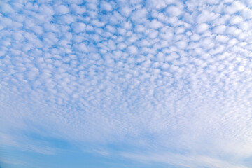 Fluffy white clouds flying on blue sky pattern background