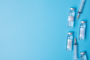 COVID-19 Vaccine vial and injection Needle Syringe against Coronavirus infection in hospital laboratory. Medical, health, Vaccination and immunization concept