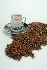 Cup Of Coffee And Coffee Beans