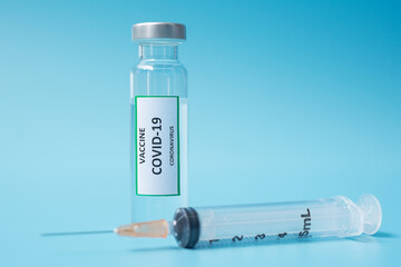 COVID-19 Vaccine vial and injection Needle Syringe against Coronavirus infection in hospital laboratory. Medical, health, Vaccination and immunization concept