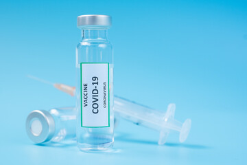 COVID-19 Vaccine vial and injection Needle Syringe against Coronavirus infection in hospital laboratory. Medical, health, Vaccination and immunization concept